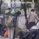 Foto: tangkapan layar video pengendara tertimpa baliho (Sumber: istimewa)