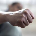 The angry man clenched his fist. Concept of violence.